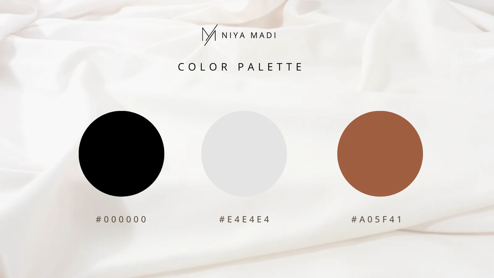 Niya Madi colour palette: black, silver and a warm clay tone
