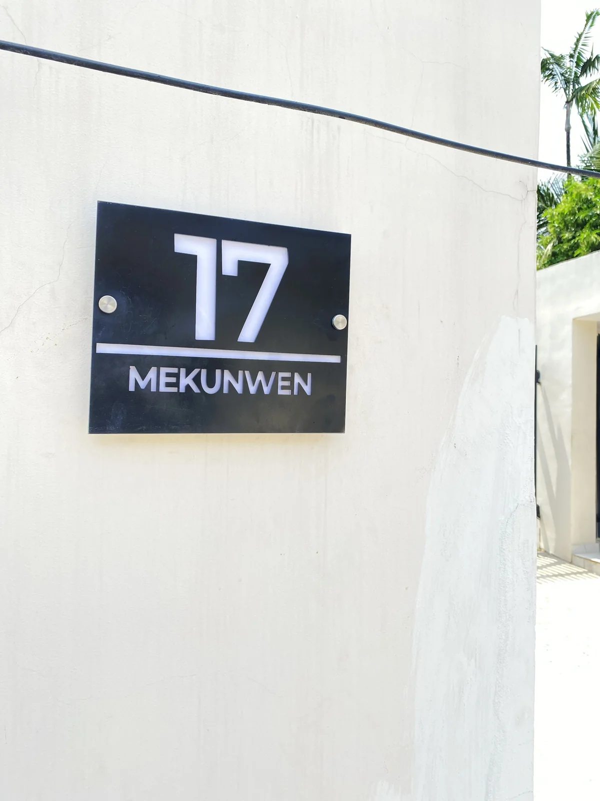 The 17 Mekunwen plaque seen at an angle showing the standoff fixings